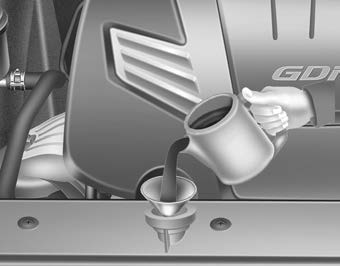 Kia Carnival: Checking the engine oil level Kia Carnival: Checking the engine oil level. If it is near or at L, add enough oil to bring the level to F. Do not overfill.